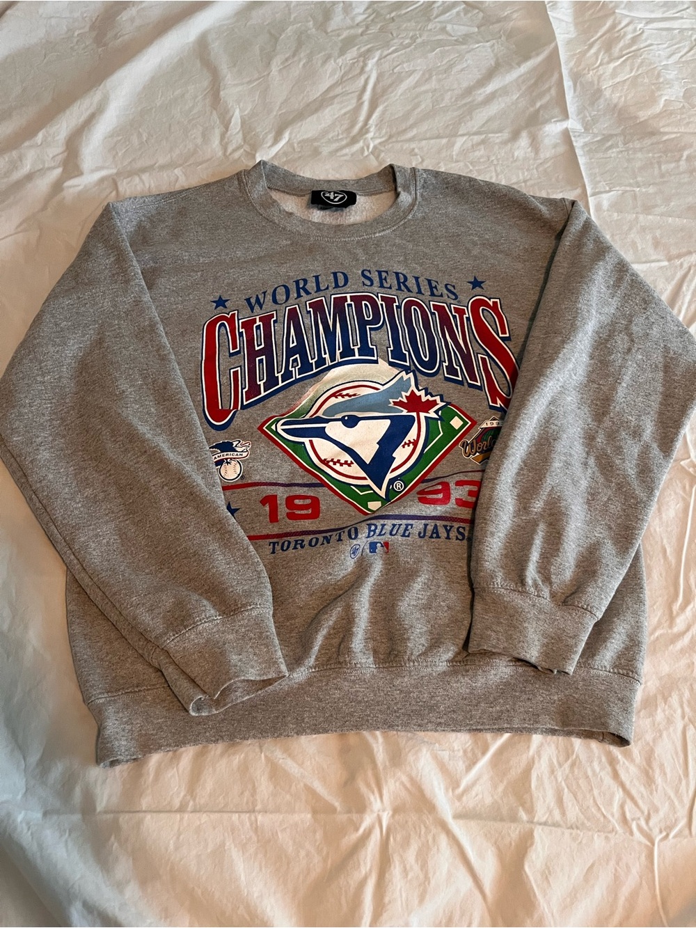 47 Brand Grey Crewneck with Red, Blue and Green Championship Graphic
